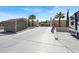 Long driveway with gate, landscaping and parking for RV or multiple vehicles at 10280 W La Mancha Ave, Las Vegas, NV 89149