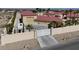 Gated entrance to a large estate with RV parking, desert landscaping, and a private setting at 10280 W La Mancha Ave, Las Vegas, NV 89149