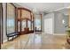 Elegant foyer with custom stained-glass windows, grand chandelier, and decorative tile flooring at 10280 W La Mancha Ave, Las Vegas, NV 89149