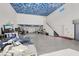Spacious garage featuring a car lift, sky painted ceiling, and ample storage at 10280 W La Mancha Ave, Las Vegas, NV 89149
