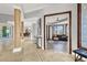 Elegant hallway with columns and tile floor at 10280 W La Mancha Ave, Las Vegas, NV 89149