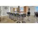 Kitchen island with gray stone finish, seating for nine, and modern stainless steel accents at 10280 W La Mancha Ave, Las Vegas, NV 89149