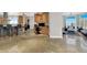 Open-concept kitchen with a large island, breakfast bar, and modern appliances at 10280 W La Mancha Ave, Las Vegas, NV 89149