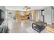 Bright kitchen features stainless steel appliances, granite countertops, and wood look tile flooring at 10280 W La Mancha Ave, Las Vegas, NV 89149