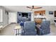 Open concept living room with tile flooring, a wet bar, and plenty of natural light at 10280 W La Mancha Ave, Las Vegas, NV 89149