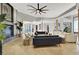 Spacious living room featuring a stone fireplace, modern furnishings, and an open layout at 10280 W La Mancha Ave, Las Vegas, NV 89149