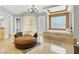 A lavish main bathroom with a walk-in shower and separate jacuzzi tub at 10280 W La Mancha Ave, Las Vegas, NV 89149