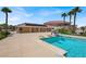 A gorgeous in-ground pool featuring a slide for summer fun in a luxurious backyard at 10280 W La Mancha Ave, Las Vegas, NV 89149