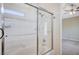 Modern bathroom featuring tub and shower with glass door at 10360 Cherry Brook St, Las Vegas, NV 89183
