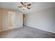 Spacious bedroom features a ceiling fan and neutral carpet at 10360 Cherry Brook St, Las Vegas, NV 89183