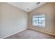 This bedroom features a window, neutral walls and carpet flooring at 10360 Cherry Brook St, Las Vegas, NV 89183