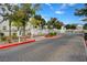 Community entrance with decorative landscaping and brick-paved driveway at 10360 Cherry Brook St, Las Vegas, NV 89183
