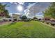 Expansive grassy area with mature landscaping offers a serene setting with walking paths and community gathering at 10360 Cherry Brook St, Las Vegas, NV 89183