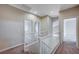 Bright upstairs hallway with white banister at 10360 Cherry Brook St, Las Vegas, NV 89183