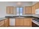 Kitchen featuring granite countertops, wooden cabinets, and stainless steel appliances at 10360 Cherry Brook St, Las Vegas, NV 89183