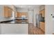 Well-lit kitchen featuring light wood cabinets and granite countertops at 10360 Cherry Brook St, Las Vegas, NV 89183