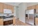 Well-lit kitchen with wooden cabinets, stainless steel appliances, and a gas stove at 10360 Cherry Brook St, Las Vegas, NV 89183