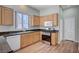 Functional kitchen with wooden cabinetry, stainless steel appliances, and granite counters at 10360 Cherry Brook St, Las Vegas, NV 89183