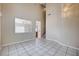 Spacious living room featuring tile flooring and staircase access at 10360 Cherry Brook St, Las Vegas, NV 89183