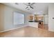 Living room leading into kitchen area with hardwood floors and natural light at 10360 Cherry Brook St, Las Vegas, NV 89183