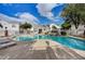 Resort-style pool with rock waterfall feature, lounge chairs, and nearby cabana for relaxing on a sunny day at 10360 Cherry Brook St, Las Vegas, NV 89183