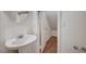 Cozy powder room with pedestal sink and mirror at 10360 Cherry Brook St, Las Vegas, NV 89183