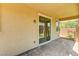 Covered patio features brick flooring and view of artificial turf lawn at 10805 Cain Ave, Las Vegas, NV 89166