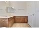 Well-lit bathroom showcasing a spacious vanity with double sinks and a linen closet at 10805 Cain Ave, Las Vegas, NV 89166