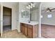 Bathroom vanity boasts sleek countertop and wood cabinetry at 10805 Cain Ave, Las Vegas, NV 89166