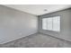 Neutral bedroom with large window provides a comfortable space to unwind at 10805 Cain Ave, Las Vegas, NV 89166