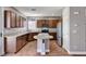 Modern kitchen with stainless steel appliances, granite countertops, and a central island at 10805 Cain Ave, Las Vegas, NV 89166