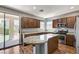 This modern kitchen features granite countertops, stainless steel appliances, and a breakfast bar at 10805 Cain Ave, Las Vegas, NV 89166