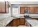 Modern kitchen features granite countertops, stainless steel appliances, and plenty of cabinet space at 10805 Cain Ave, Las Vegas, NV 89166
