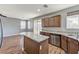 Open kitchen featuring granite countertops, stainless steel appliances, and wood-style flooring at 10805 Cain Ave, Las Vegas, NV 89166