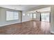 Bright living room featuring hardwood flooring and natural light from the large windows at 10805 Cain Ave, Las Vegas, NV 89166