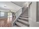 Carpeted staircase leading to the upper level, complemented by gray walls and white trim at 10805 Cain Ave, Las Vegas, NV 89166