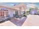 Backyard view with covered patio, outdoor seating, and bicycles, creating an inviting and functional outdoor living area at 1112 Sandy Cove St, Las Vegas, NV 89110