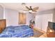 Comfortable bedroom with ceiling fan, closet, and natural light at 1112 Sandy Cove St, Las Vegas, NV 89110