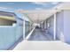 Long carport with covered parking and access to the home, offering ample space for vehicles and storage at 1112 Sandy Cove St, Las Vegas, NV 89110