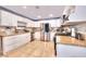 Bright kitchen featuring white cabinets, stainless steel appliances, and tile flooring at 1112 Sandy Cove St, Las Vegas, NV 89110