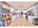 Well-lit kitchen with white cabinetry, stainless steel appliances, and granite countertops at 1112 Sandy Cove St, Las Vegas, NV 89110
