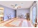 Inviting living room with tiled floors, ceiling fan, and a charming bar area for entertaining at 1112 Sandy Cove St, Las Vegas, NV 89110