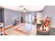 Open concept living room with tiled floors, neutral walls, and an inviting atmosphere at 1112 Sandy Cove St, Las Vegas, NV 89110