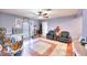 Open concept living room with tiled floors, neutral walls, and a spacious design at 1112 Sandy Cove St, Las Vegas, NV 89110