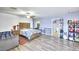 Spacious primary suite featuring modern flooring, a large bed, and generous storage at 1112 Sandy Cove St, Las Vegas, NV 89110