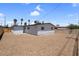 Spacious backyard with privacy fence and xeriscaped yard for low maintenance at 1115 W Nelson Ave, North Las Vegas, NV 89030