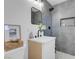 Modern bathroom with stylish gray tiling, sleek fixtures, and a framed mirror at 1115 W Nelson Ave, North Las Vegas, NV 89030