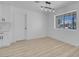 Dining area featuring modern lighting, a large window, and stylish flooring at 1115 W Nelson Ave, North Las Vegas, NV 89030
