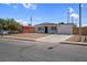 Charming single-story home featuring a xeriscaped front yard, covered entry, and a driveway at 1115 W Nelson Ave, North Las Vegas, NV 89030