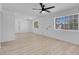 Bright living room with hardwood floors, ceiling fan, and windows providing ample natural light at 1115 W Nelson Ave, North Las Vegas, NV 89030